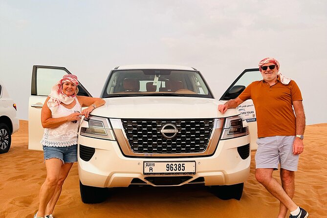 Sunset Desert safari with Camel Ride Sand Board & BBQ Dinner - Dune bashing and sandboarding