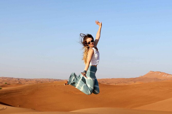 Thrilling Desert Safari Dubai Adventure with Sand Boarding and Barbecue Dinner - Camel riding, coffee, dates, and the Bedouin-style camp