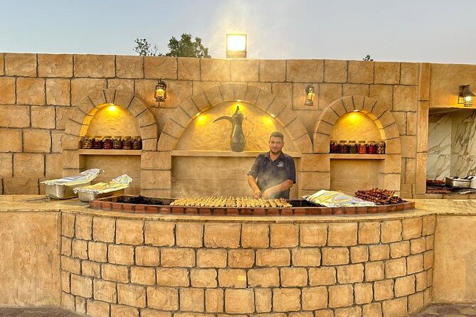 Thrilling dune bashing with VIP Desert camp delicious BBQ & shows - BBQ dinner, shawarma, falafel, and Arabic sweets