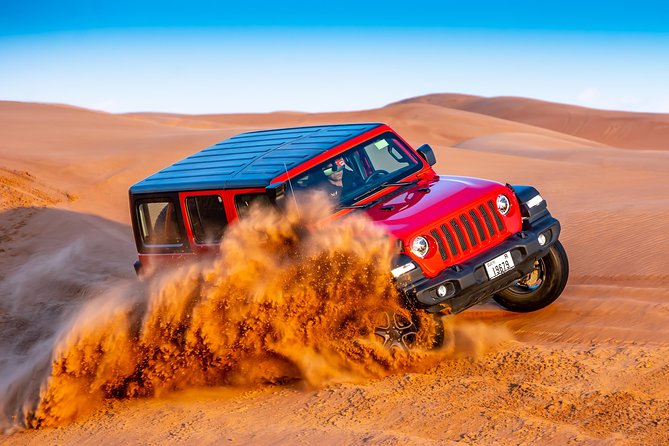VIP Desert Safari Private & Front Area VIP Table Service - Red-dune dune bashing in a 4WD