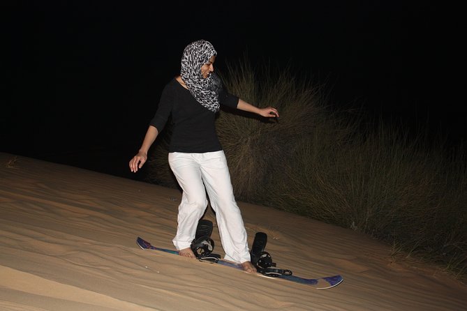 Wow Arabian Nights Tours Desert Safari Program with BBQ Dinner - Camel ride and sand boarding